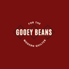 Gooey Beans. Subtitle: for the modern quilter. Burnt red background, with beige text on top of three squares on point.