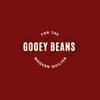 Gooey Beans. Subtitle: for the modern quilter. Burnt red background, with beige text on top of three squares on point. 